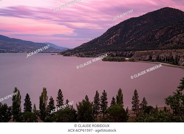 Okanagan Lake with Sun Oka beach and Highway 97 after sunset. Between the towns of Summerland and Penticton in British Columbia, Canada