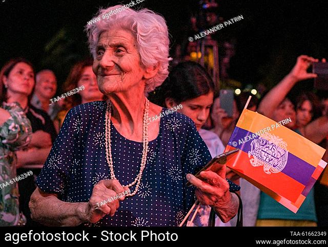 ARMENIA, YEREVAN - SEPTEMBER 2, 2023: A woman takes part in a rally in support of Nagorno-Karabakh outside the Armenian National Opera and Ballet Theatre