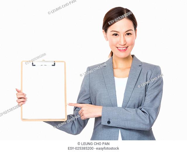 Asian businesswoman with finger point to blank clipboard