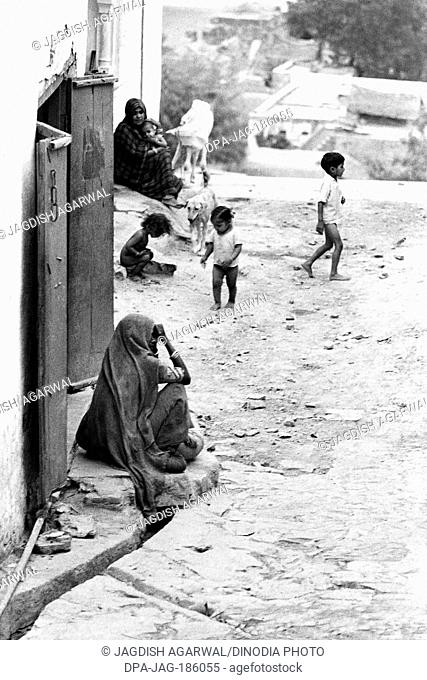 Indian woman sitting in village street Barsana Vrindavan Uttar Pradesh India Asia 1971