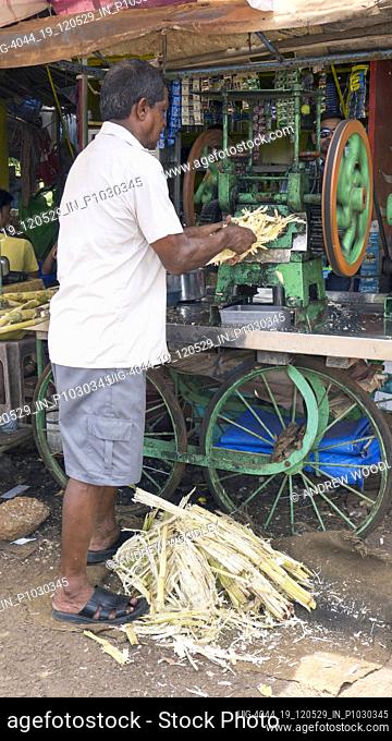 Extracting sugarcane juice Mapusa Goa India