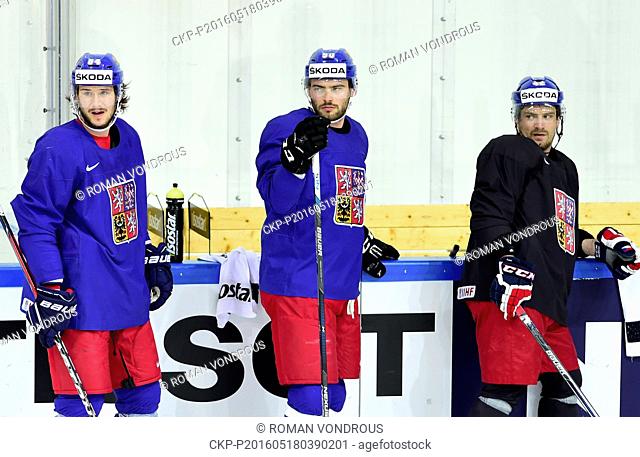 Players Tomas Kundratek, from left, Robert Kousal and Petr Koukal attend the training session of Czech National Hockey Team prior to tomorrow's quarterfinal...