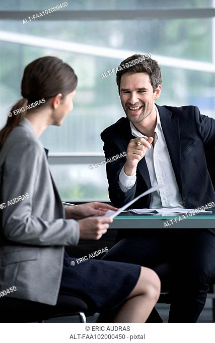 Businessman man having lighthearted meeting with client