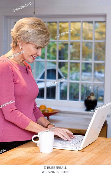 Mature woman with laptop