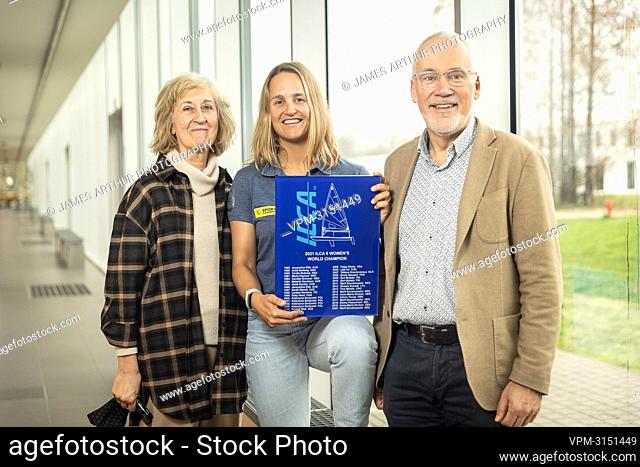 Belgian Sailor Emma Plasschaert poses with her parents after a press moment with the new world champion of the Laser Radial (Category ILCA 6) class