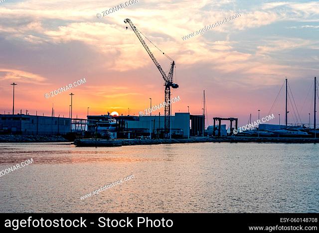 Scenic view of the harbour of a Mediterranean city at sunset. Denia, Alicante, Spain
