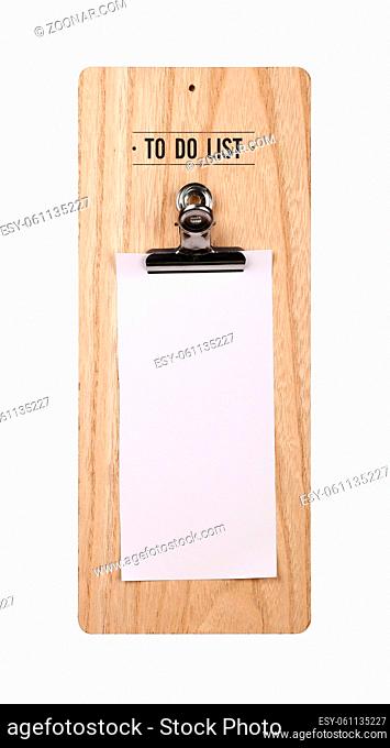 Close up one wooden holder with metal clip and blank white paper to do list note, isolated on white background