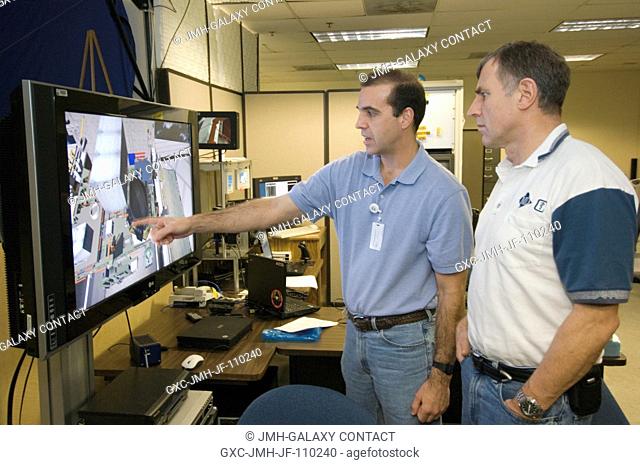Astronaut Richard A. (Rick) Mastracchio (left) and Canadian Space Agency astronaut Dafydd R. (Dave) Williams, both STS-118 mission specialists