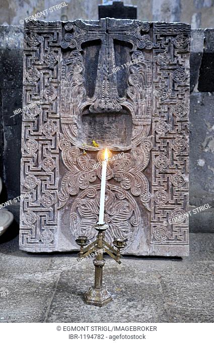 Candleholder and historic cross-stone, khachkar in the Armenian Orthodox church of St. Hripsime, UNESCO World Heritage Site, Echmiadzin, Armenia, Asia