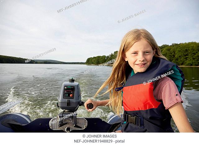 Teenage girl on boat, Skane, Sweden