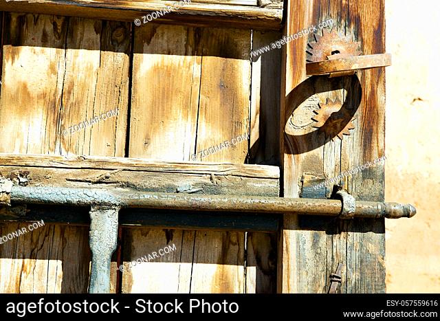 metal brown  morocco in  africa the old wood facade home and rusty safe padlock