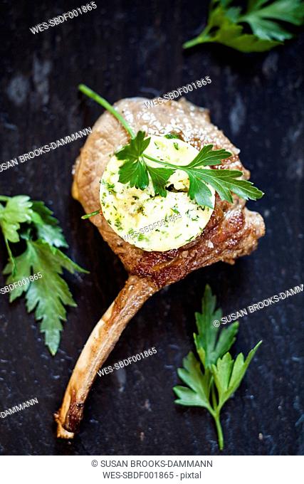 Slice of compound butter on lamb chop