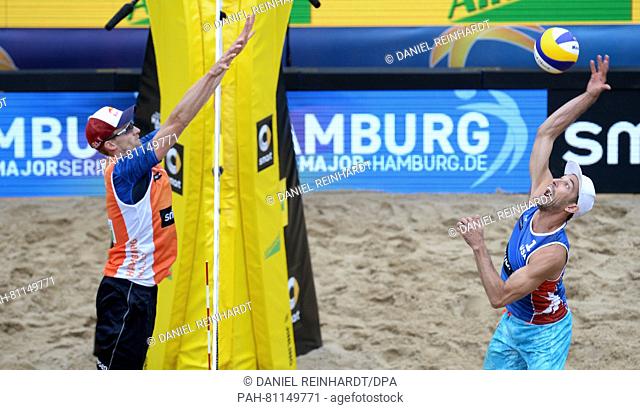 Nicholas Lucena (R) and Philip Dalhausser (not pictured) of the USA in action against Alexander Brouwer (not pictured) and Robert Meeuwsen (L) of the...