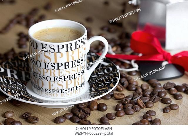 Espresso cup, espresso can and coffee beans