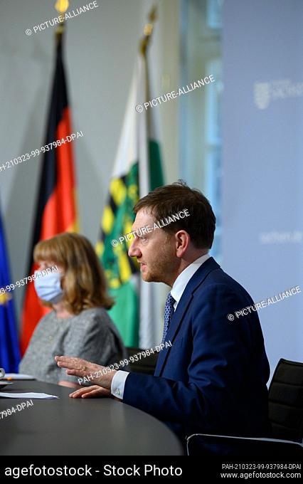 23 March 2021, Saxony, Dresden: Michael Kretschmer (CDU), Prime Minister of Saxony, attends a press conference in the Saxon State Chancellery alongside Petra...