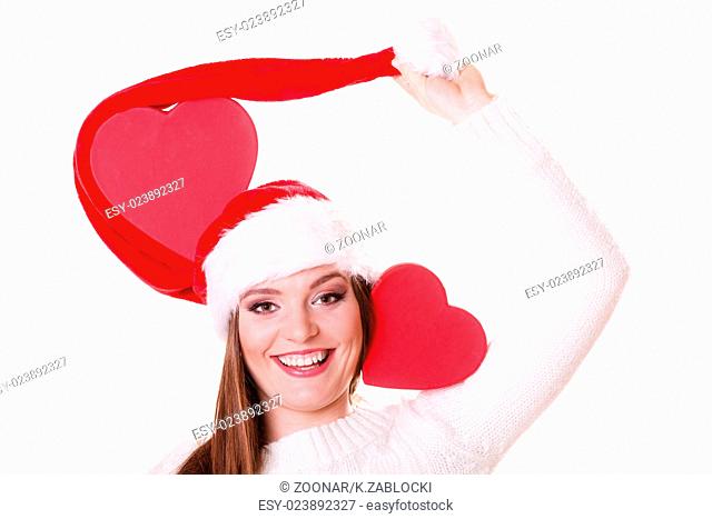 Happy girl in santa hat heart shaped box