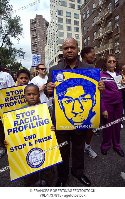 Thousands of demonstrators march down Fifth Avenue in New York for a silent march protesting the NYPD policy of stop and frisk The participants say that the...
