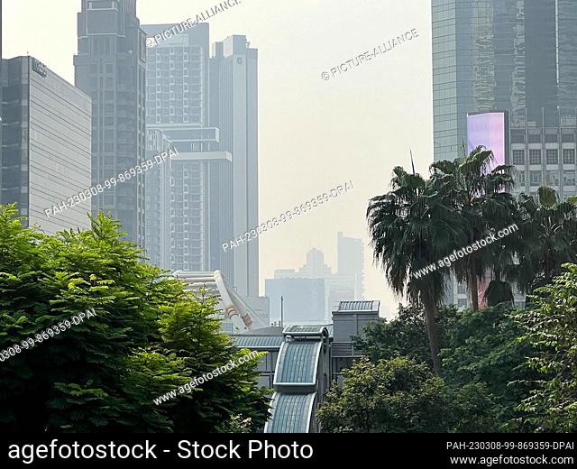 08 March 2023, Thailand, Bangkok: Smog hangs over the city in the Sathorn district. Actually, the sky would be blue, but Bangkok and other parts of Thailand are...