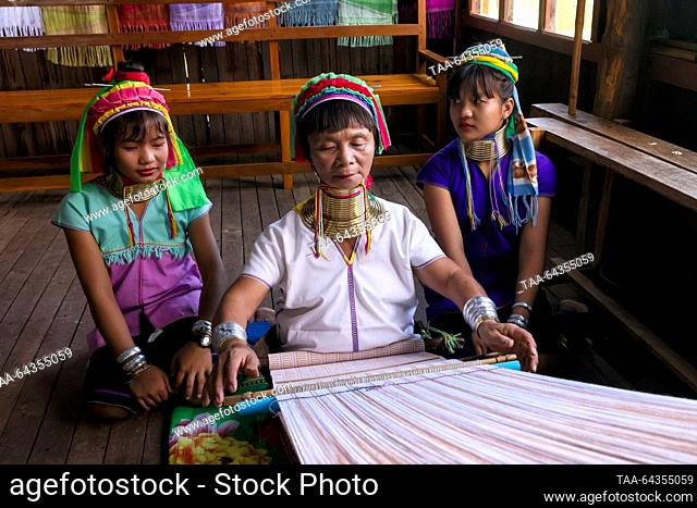 MYANMAR - OCTOBER 27, 2023: Kayan Lahwi women are seen in the village of Ywama on Lake Inle; there are 17 Intha villages along the lake's shores