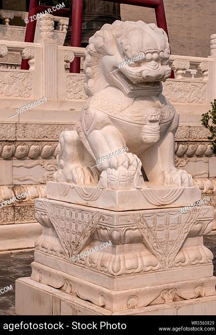 Large marble lion statue at entrance to Giant Wild Goose Pagoda in Xi'an
