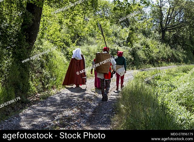 Pilgrims on the Via Francigena. 14th Century. Walking on a path in the fields. Tuscany 24th April 2016