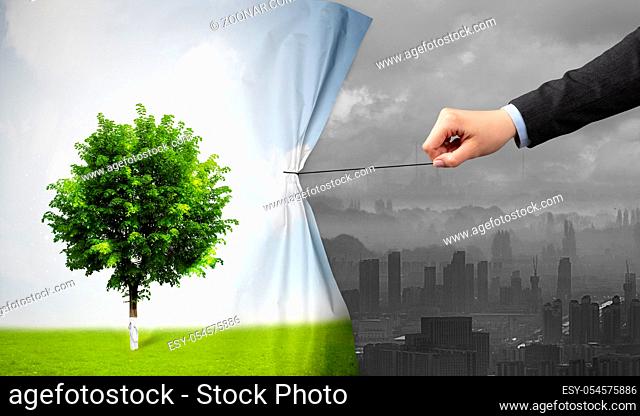 hand pulling nature cityscape curtain to gray cityscape, environmental protection concept