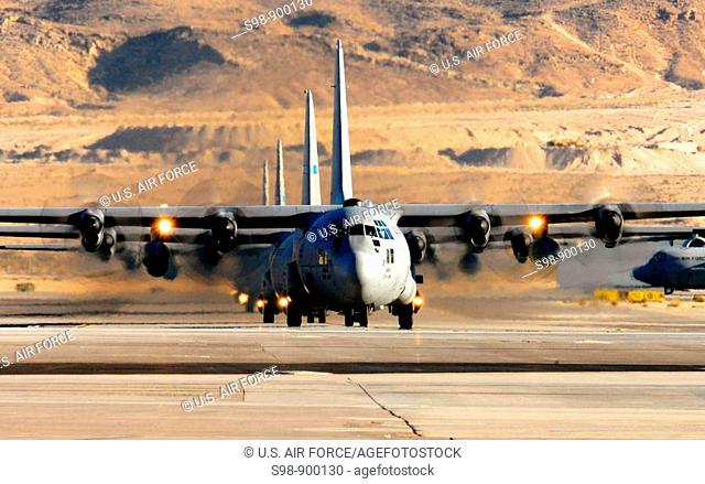 A formation of C-130 Hercules taxis in after a training mission during the U S  Air Force Weapons School's Mobility Air Forces Exercise MAFEX at Nellis Air...