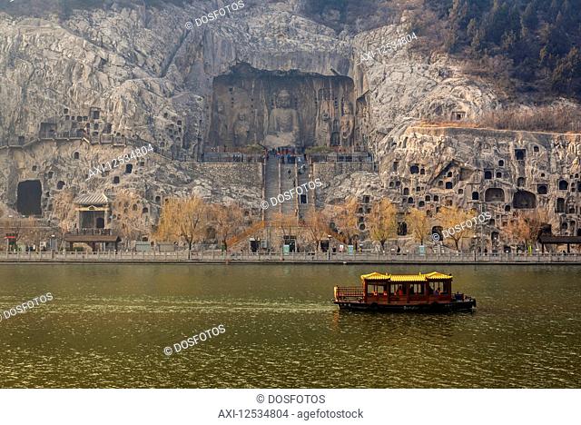 The Longmen Caves, some of the finest examples of Chinese Buddhist art housing tens of thousands of statues of Buddha and his disciples; Luoyang, Henan Province