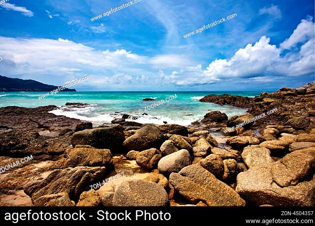 Exotic stones tropical beach under blue sky. Thailand