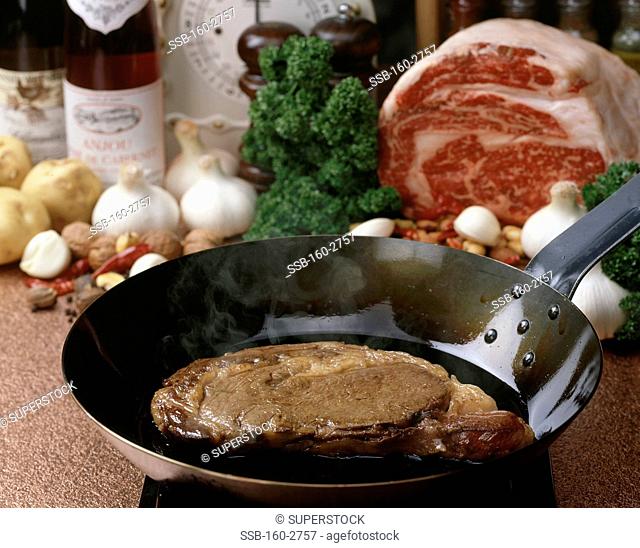 Close-up of steak in a pan