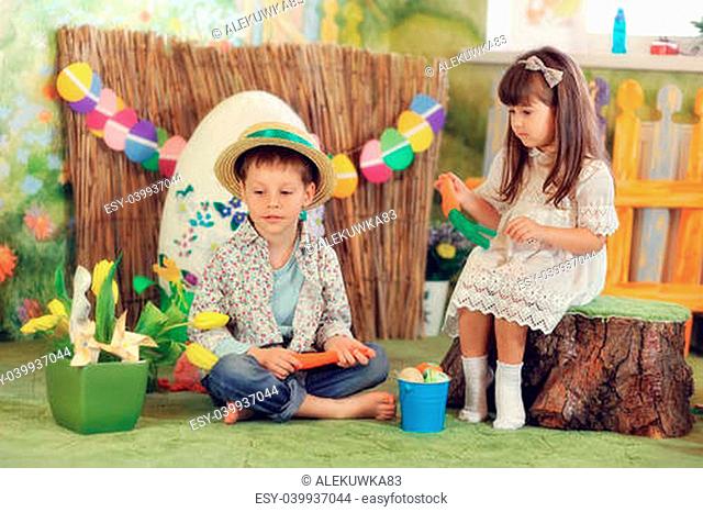 a fabulous farm with yellow tulips boy and girl playing with a carrot