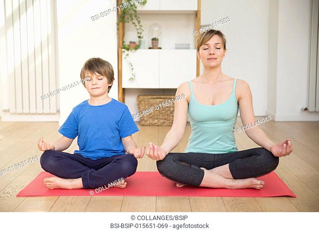 Mother and son practicing meditation