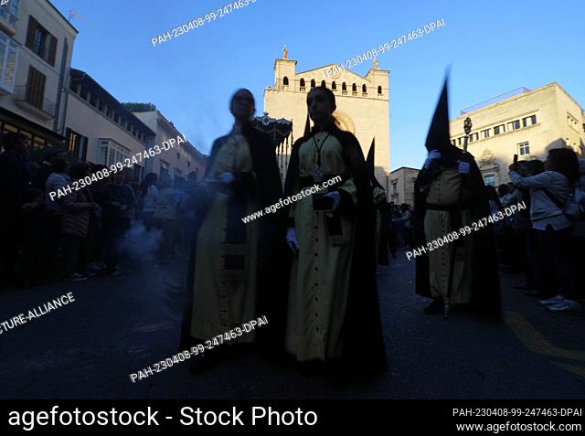 07 April 2023, Spain, Palma: Penitents with incense participate in the procession ""Sant Enterrament"" (Holy Burial) in Palma