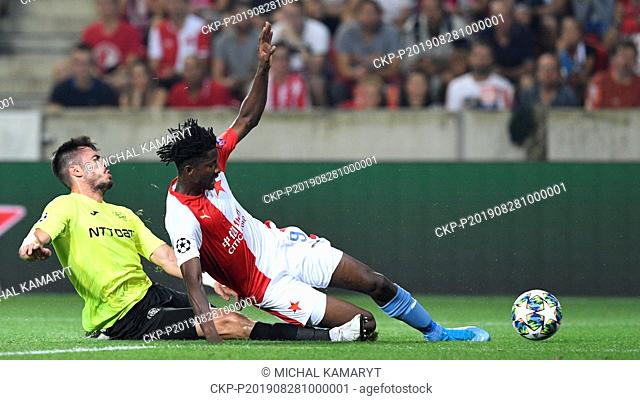 From left ANDREI BURCA of CFR and PETER OLAYINKA of Slavia in action during the Football Champions' League 4th qualifying round return match: Slavia Prague vs...