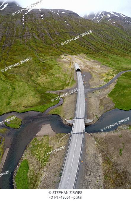 Drone view of road over stream, Iceland