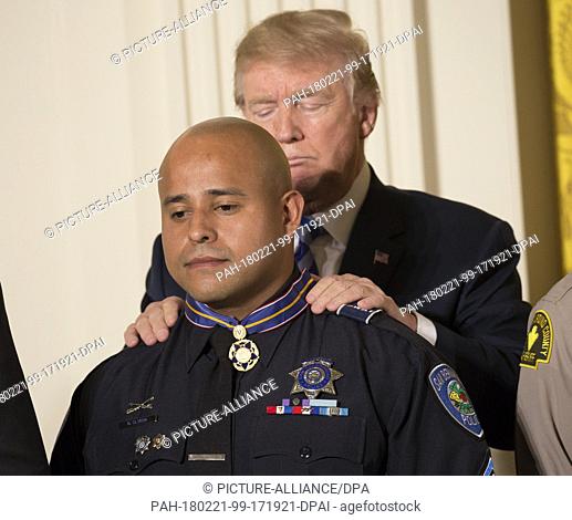 United States President Donald J. Trump presents Detective Brian Olvera, San Bernardino Police Department the presentation of the Public Safety Medal of Valor...