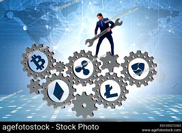 Businessman in cryptocurrency concept with spanner