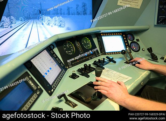 PRODUCTION - 30 June 2022, Saarland, Saarbrücken: Andreas Lutz controls a train in the rail simulator. All train drivers have to have their driving skills...