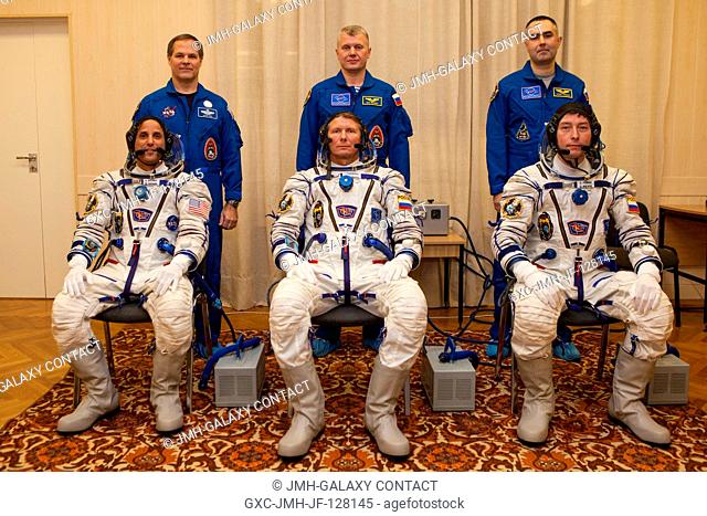 Expedition 31 Flight Engineer Joe Acaba, seated left, Soyuz Commander Gennady Padalka, and, Flight Engineer Sergei Revin, seated right