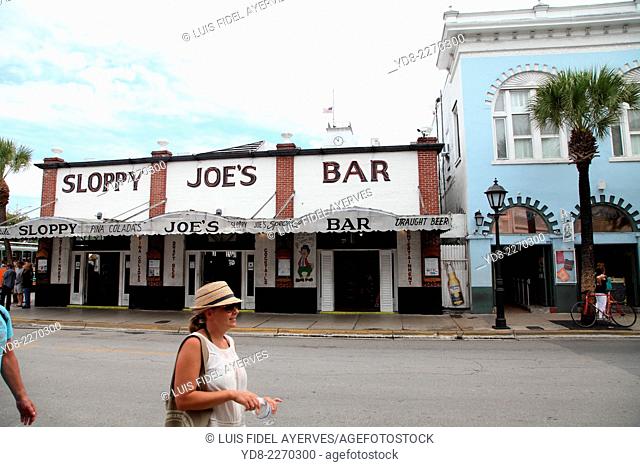 Tourists enjoying the Duval Street in Key West, Florida, Key West is a city in Monroe County, Florida, United States. The city encompasses the island of Key...