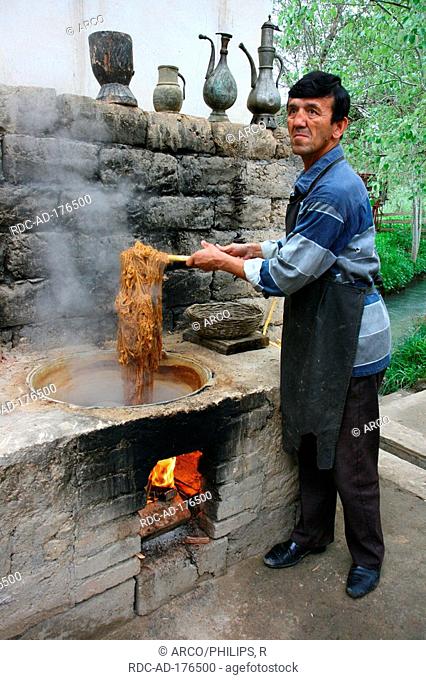 Worker, paper production of bark of mulberry, Samarkand, Uzbekistan