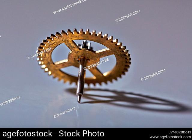 Clockwork cogwheel on a desk