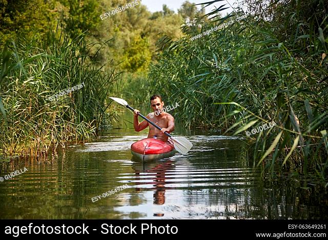 Kayaking on a small water passage. Lake Tisza, Hungary