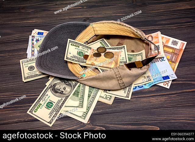 Money in the old cap. Financial concept background