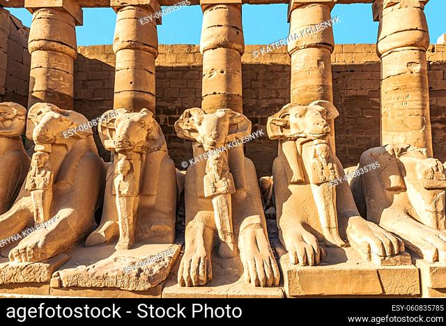 Ruined statues of sphinxes near columns in Karanak temple