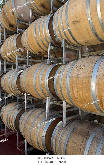 Wine barrels in shelves at cellar