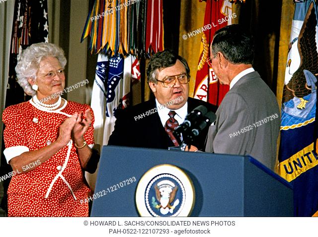 United States President George H.W. Bush and first lady Barbara Bush present the Presidential Citizens Medal to United States Deputy Secretary of State Lawrence...