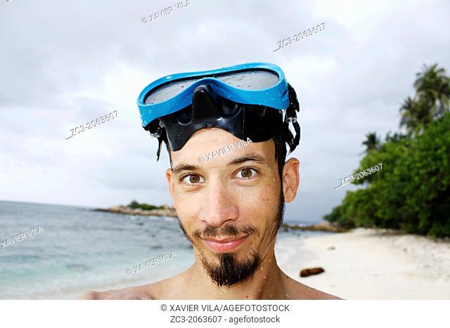 Self-portrait of a man with a diving mask, Island Pulau Perhentian Kecil, China sea, Terengganu, Malaysia