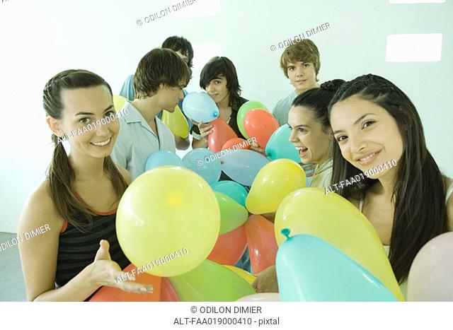 Group of young friends with balloons