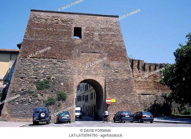 Porta San Maggiore. Town walls, gate. Cars parked